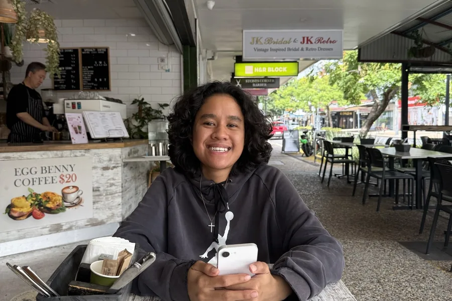 A participant enjoying coffee at a local cafe
