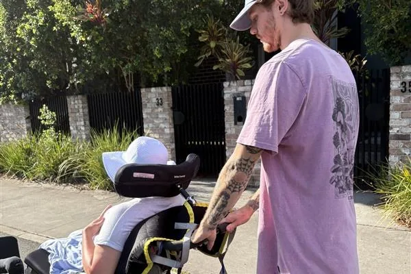 A support worker out on a neighbourhood walk with a participant